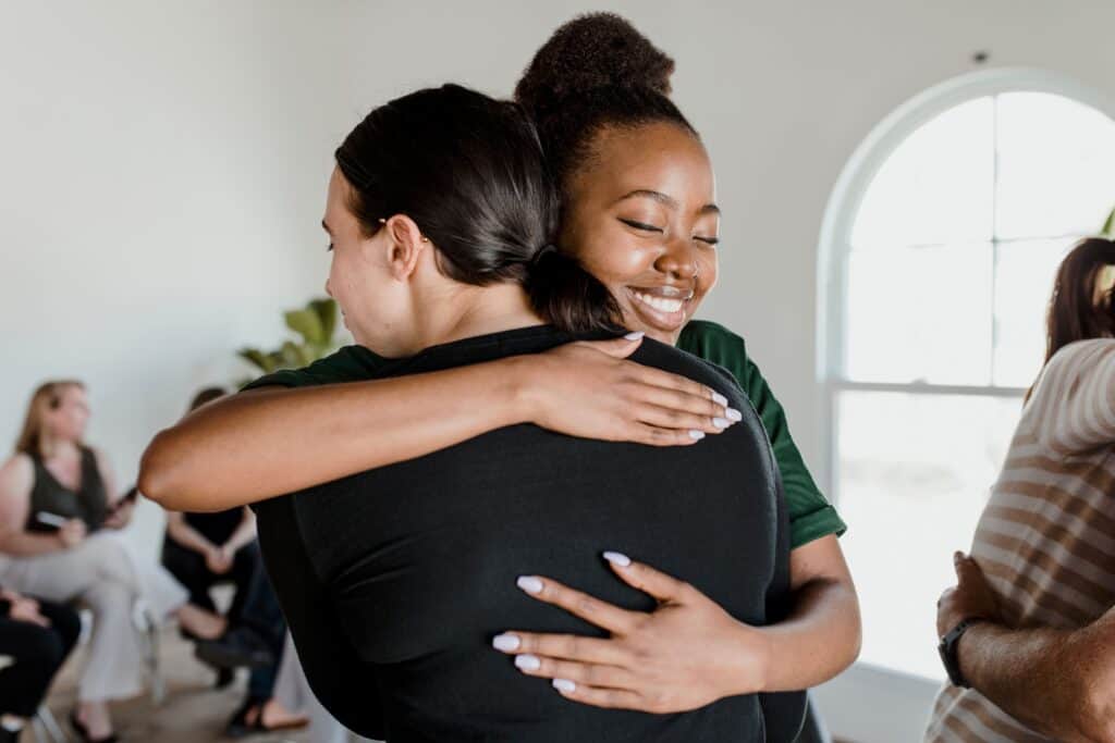 A woman is comforted during grief counseling boca raton