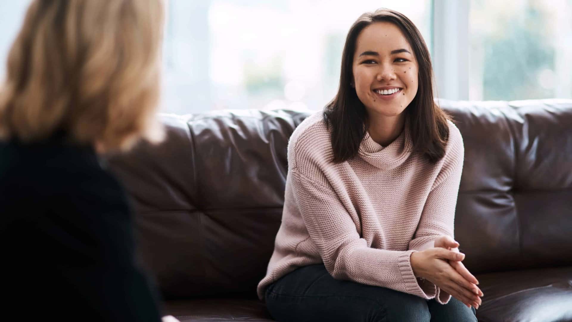 A woman happy about the benefits of depression treatment in Boca Raton.