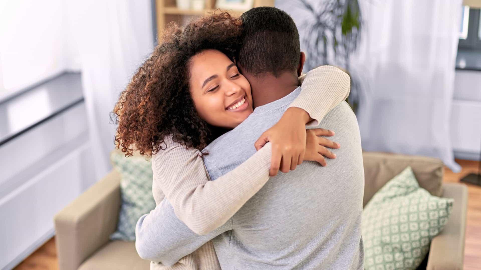 Happy woman hugging her husband after marriage counseling in Boca Raton.