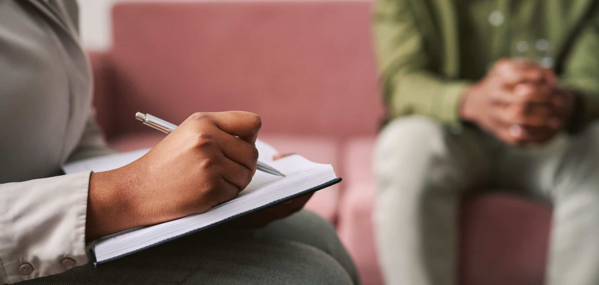 A therapist takes notes during OCD treatment in Boca Raton.