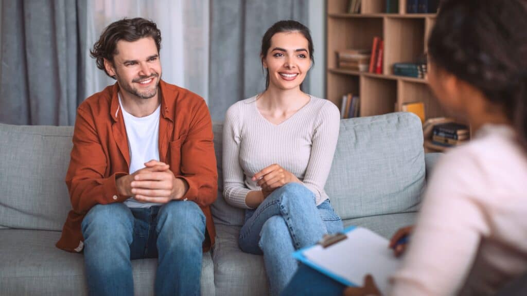 Couple listening to the therapist during marriage counseling in Boca Raton.