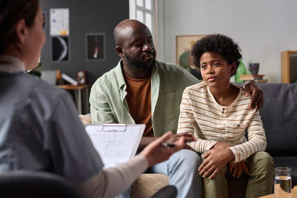 A man takes his son to parenting counseling in boca raton