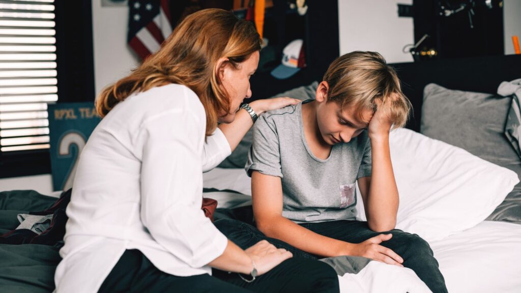 A mother encourages her son to consider child therapy in Boca Raton.